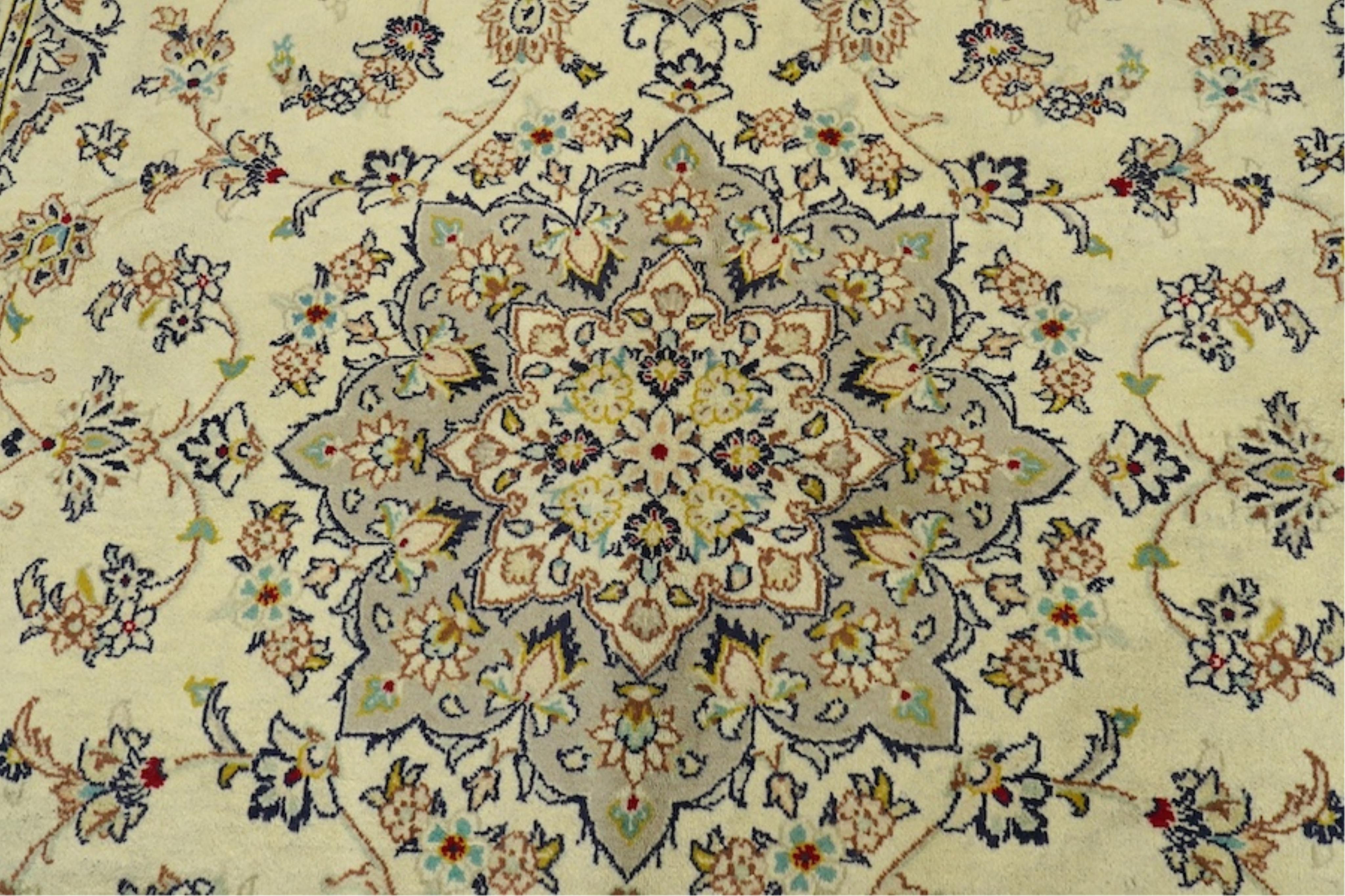 A Kashan ivory ground carpet, 300 x 195cm. Condition - good